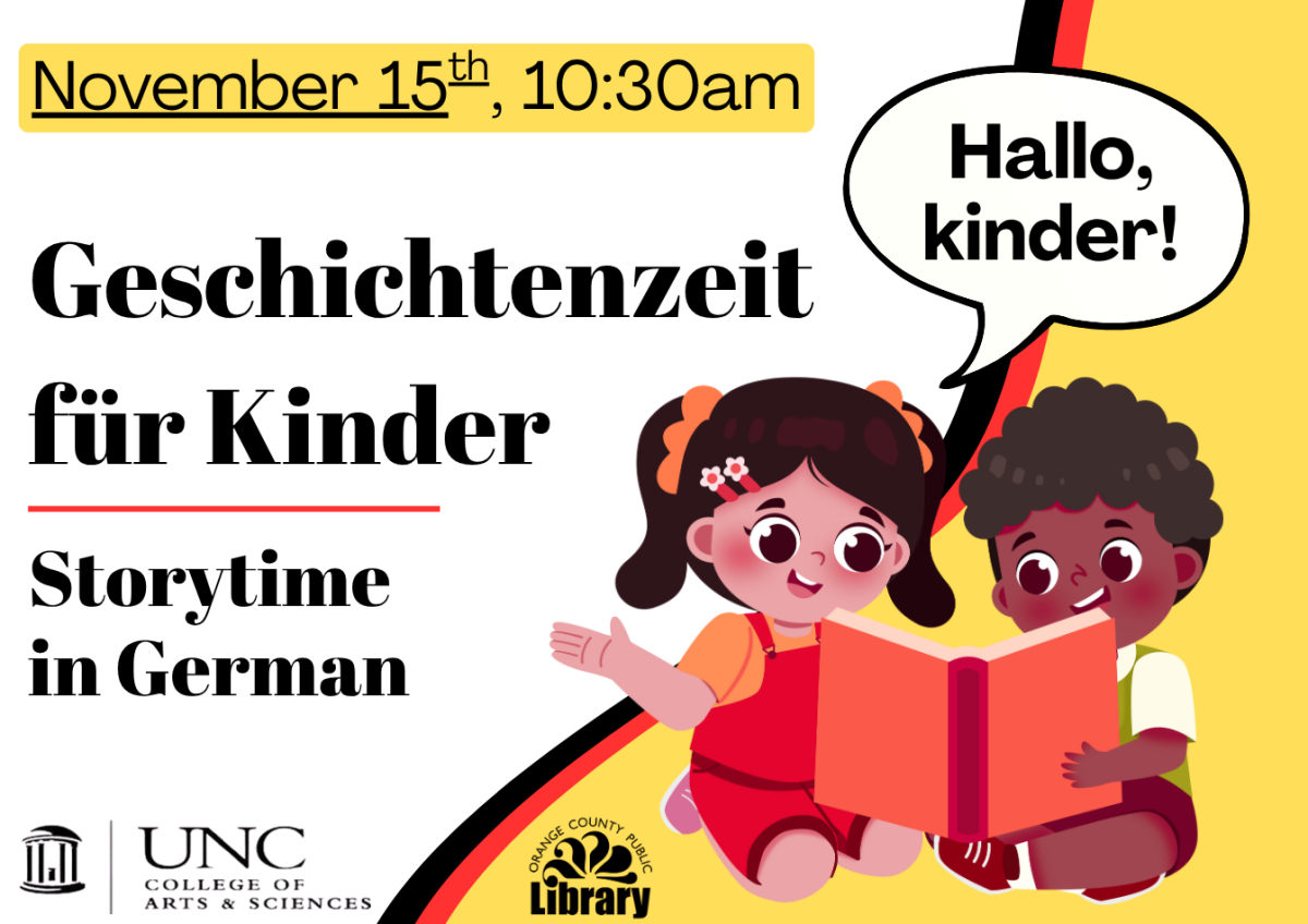 two children sitting and reading a book with German flag color scheme